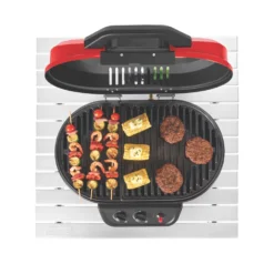 Coleman RoadTrip® 225 Portable Tabletop Propane Grill 16 Coleman RoadTrip® 225 Portable Tabletop Propane Grill -Campout Gear Shop 2000033047 coleman grills 225 TT heritage red flames turned on food on grates overhead 3